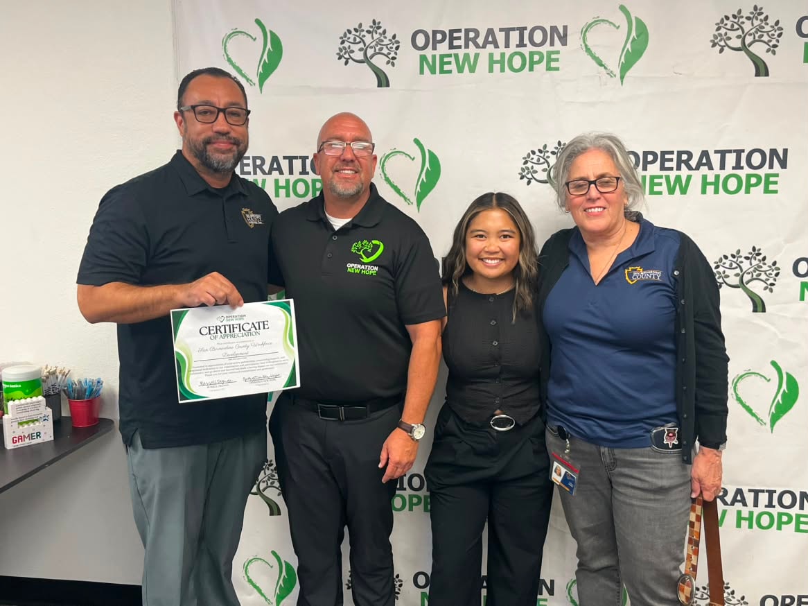 Community Partner of the Month July 2026 — San Bernardino County Workforce Development Department certificate presentation at Operation New Hope