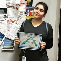 Inland Career Education Center CNA graduate 2023 holding certificate