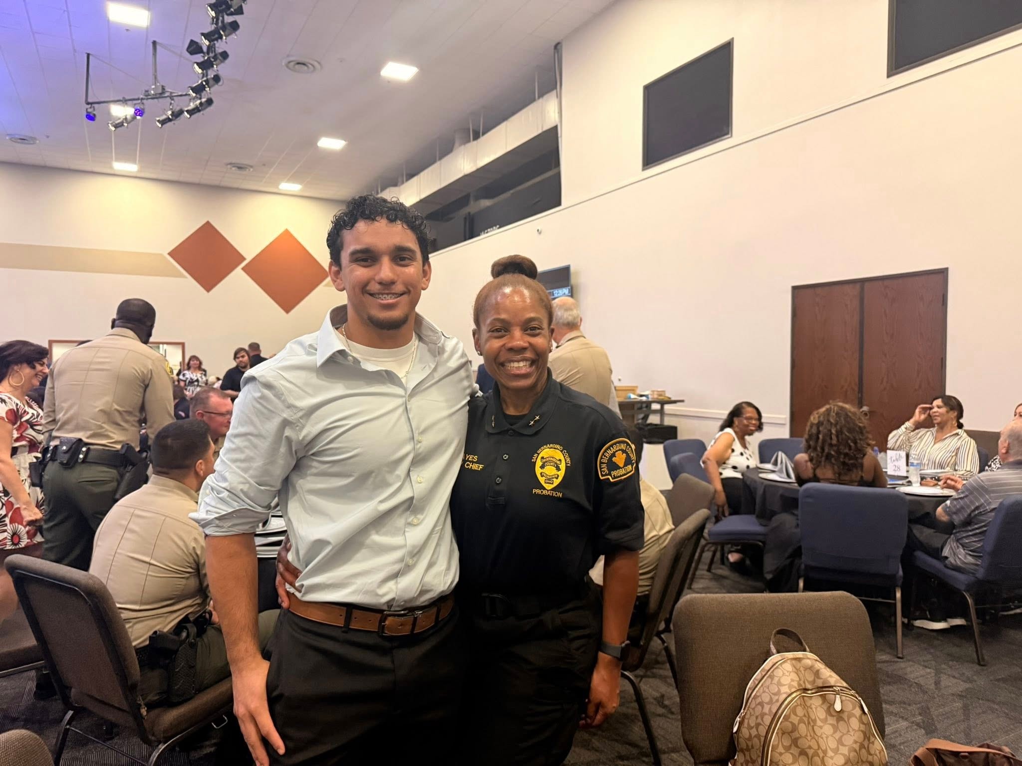 ONH program manager Mario with probation officer at community event