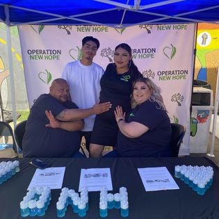 Operation New Hope staff at community outreach booth event