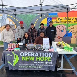 Operation New Hope Learning Center booth at community event