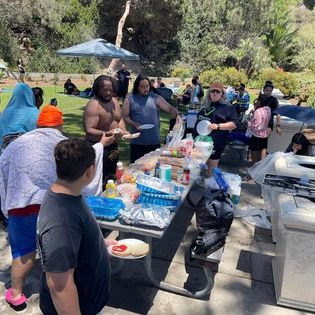 Students at BBQ picnic during beach day 2022