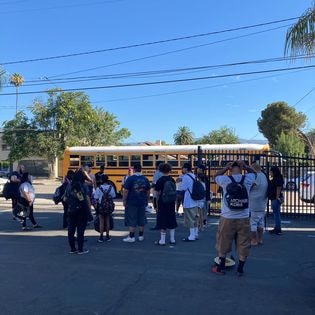 Students boarding school bus for beach day 2022