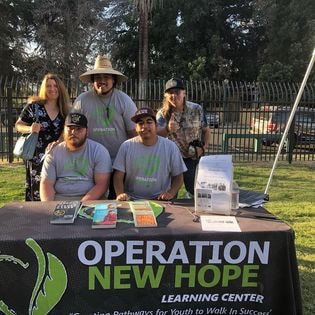 Operation New Hope booth at Parks & Recreation community event