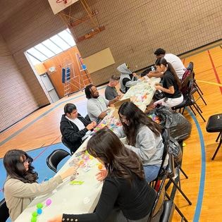 Students painting mural at San Bernardino Parks & Recreation community service