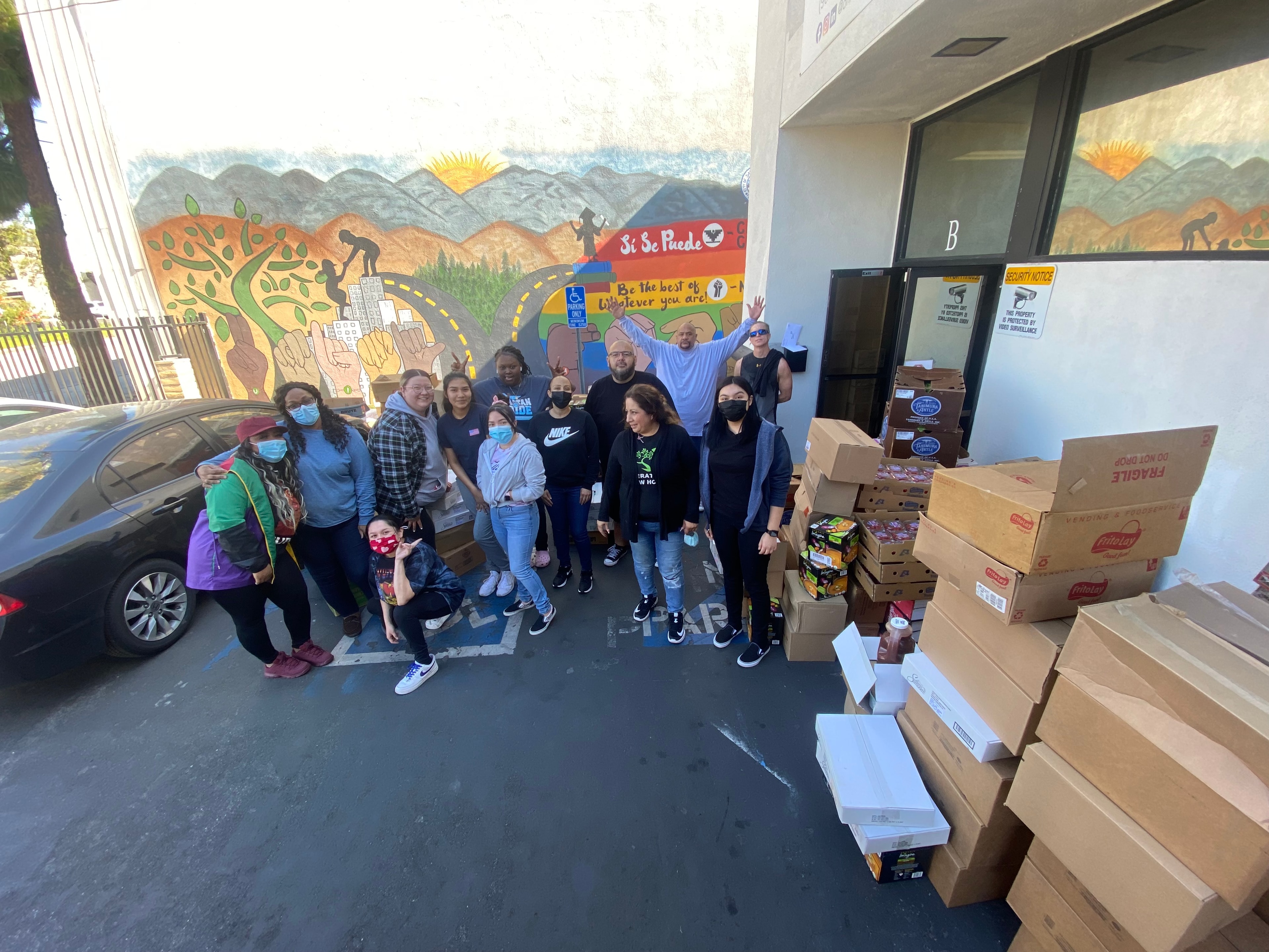 Students giving food at HEAL Project community outreach